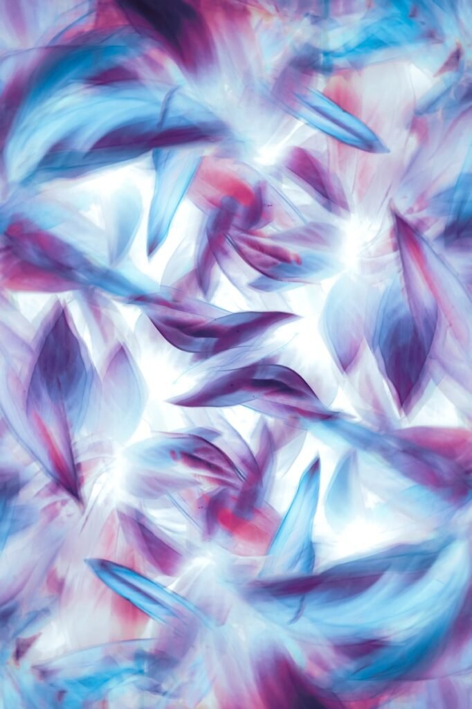 an abstract painting of blue and purple leaves