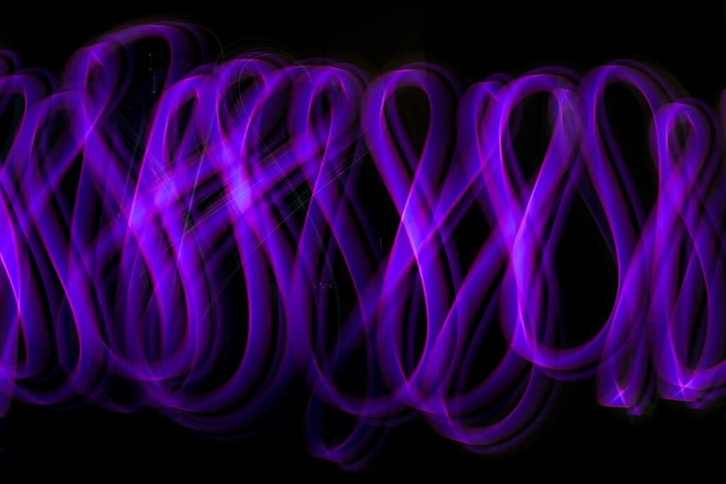 a group of purple lights in the dark