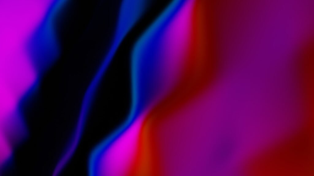 Abstract flowing shapes of vibrant colors.